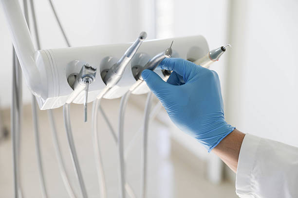 Professional Tooth Extraction technician working in Fort Wayne, IN